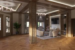 ein Wohnzimmer mit 2 Stühlen und einem TV in der Unterkunft ART ECO HOTEL in Taschkent