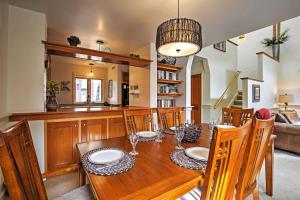 a dining room with a wooden table and chairs at Hot Tub and Grilling Area Keystone Townhome! in Keystone