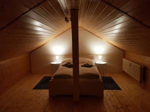 a bed in a small room with two tables at Ludwigstraße in Mönchengladbach