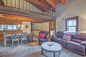 a living room with a couch and a table at Truckee Condo with Grill and Northstar Resort Shuttle in Truckee