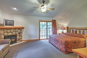 a bedroom with a bed and a fireplace at Cozy Townhome, Half Mi to Starved Rock State Park! in Utica