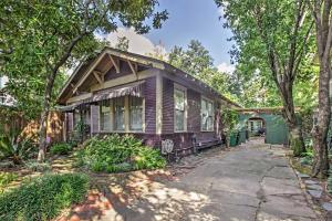 an old wooden house with a driveway at Quaint Houston Hideaway with Yard Less Than 3 Mi to Downtown in Houston