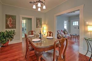 a dining room and living room with a table and chairs at Quaint Houston Hideaway with Yard Less Than 3 Mi to Downtown in Houston