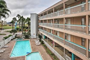 an aerial view of a hotel with a swimming pool at Surfside Sandcastle Suite with Balcony and 2 Pools! in Corpus Christi