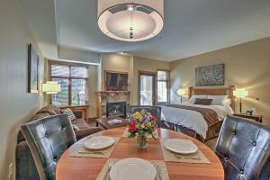 a living room with a bed and a table and chairs at Ski-InandSki-Out Studio at Sundial Lodge with Hot Tub! in Park City