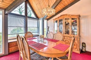 a dining room with a wooden table and chairs at Oceanfront Irish Beach Sea Haven Home with Hot Tub in Manchester +26 photos