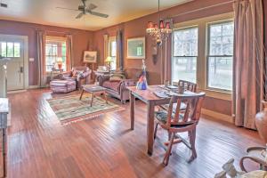 a living room with a table and chairs at August Schmidt Fredericksburg Cottage with Hot Tub in Fredericksburg