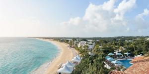 an aerial view of the beach and the ocean at La Samanna, A Belmond Hotel, St Martin in Baie Longue