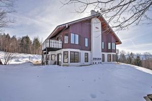 ein großes Haus im Schnee mit Schnee in der Unterkunft Scenic Bartlett Home with Deck - 1 Mi to Storyland! in Bartlett