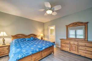a bedroom with a bed and a ceiling fan at Updated Family Getaway Walk to Sea Haven Beach! in North Topsail Beach