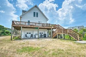 a house with a porch with a wooden deck at Updated Family Getaway Walk to Sea Haven Beach! in North Topsail Beach