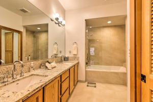 a bathroom with two sinks and a large mirror at Deck with Forest Views Incline Village Townhome in Incline Village +16 photos