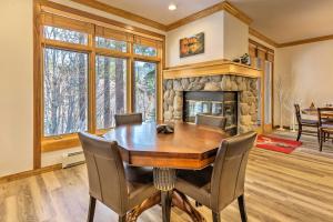 a dining room with a table and a fireplace at Deck with Forest Views Incline Village Townhome in Incline Village