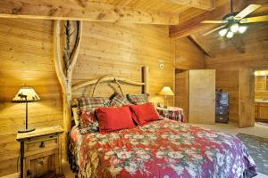 a bedroom with a bed and a ceiling fan at Bear View Lodge in Alma 15 Mi to Breckenridge! in Alma