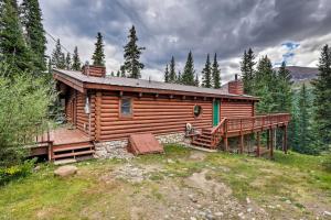 a log cabin in the woods with a large deck at Bear View Lodge in Alma 15 Mi to Breckenridge! in Alma