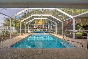Piscina de la sau aproape de Tropical Cape Coral Home with Private Dock on Canal!