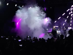 a man standing in front of a stage with smoke at Chalets in Porto Matrouh Families Only in Marsa Matruh +177 photos