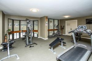 a gym with several treadmills and exercise equipment at Oceanfront Condo with Balcony in Myrtle Beach! in Myrtle Beach