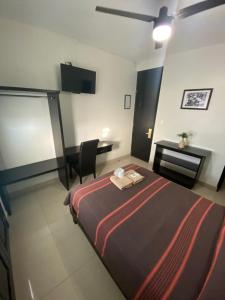Postel nebo postele na pokoji v ubytování Hotel Jiménez