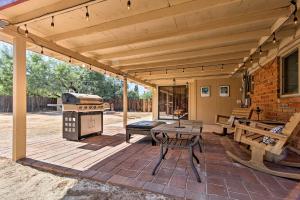 an outdoor patio with a grill and a picnic table at Renovated Tucson Gomez Casita with Yard Less Than 7 Mi to DT in Tucson