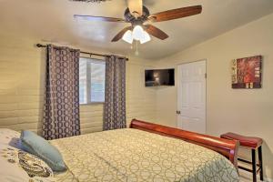a bedroom with a bed and a ceiling fan at Renovated Tucson Gomez Casita with Yard Less Than 7 Mi to DT in Tucson