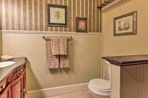 a bathroom with a toilet and a sink at Historic Huntington Home with Pond and Flower Gardens! in Zavalla +23 photos