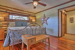 a bedroom with a bed and a star on the wall at Gruene Cabin - Pet Friendly New Braunfels Studio in New Braunfels