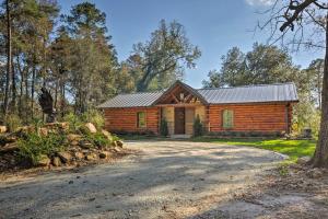 a log cabin in the woods with a driveway at Beaver Creek Lodge - Huntington Home with Pond! in Huntington