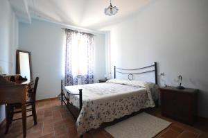 Letto o letti in una camera di Casa Cardarella