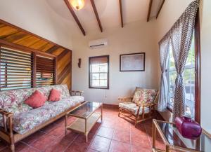 a living room with a couch and a chair at X'tan Ha- The Waterfront in San Pedro