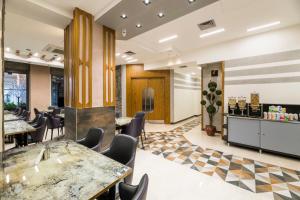a lobby of a restaurant with tables and chairs at Classy Suite Taksim in Istanbul
