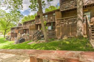 a building with trees in front of it at Clearwater Lake Getaway with Shared Pool and Boat Dock in Annandale