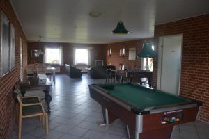 a living room with a pool table in it at Paarup Kro in Engesvang