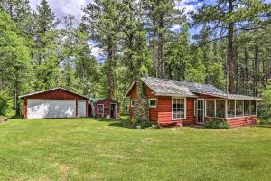 a cabin in the woods with a large yard at Historic Keystone Cabin Near Mount Rushmore! in Keystone