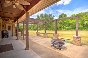 an outdoor patio with a grill and a roof at Spacious Stallion Lake Ranch Home with Patio in Van