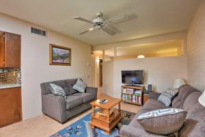 a living room with two couches and a flat screen tv at Green Valley Townhome with Resort Amenities! in Green Valley
