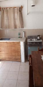 a kitchen with a counter top and a stove at Apartamentos Flor de Lis in La Paloma