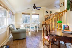 a living room with a table and a dining room at Home by Beach 5 - The Treehouse in Naples