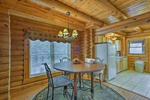 a dining room with a table and a refrigerator at Pigeon Forge Vacation Rental 1 Mi to Dollywood in Pigeon Forge