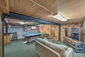 a living room with a pool table and a table at Waterfront Port Angeles Home with Harbor Views in Port Angeles