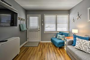 a living room with a couch and a table at North Wildwood Condo with Pool, Walk to Boardwalk! in North Wildwood