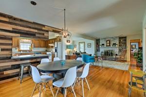 a kitchen and living room with a table and chairs at Quaint Elkton Home near Shenandoah National Park! in Elkton