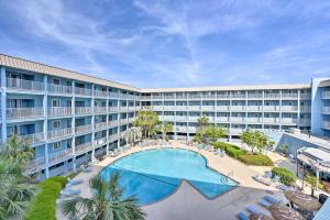 an aerial view of a hotel with a large swimming pool at Walkable Hilton Head Island Condo with Resort Perks in Hilton Head Island