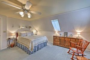 a bedroom with a bed and a ceiling fan at Charming Owls Head Retreat 2 Mi to Rockland Coast in Owls Head