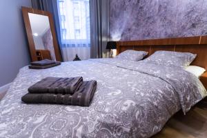 Posteľ alebo postele v izbe v ubytovaní Apartament 56