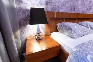 Posteľ alebo postele v izbe v ubytovaní Apartament 56