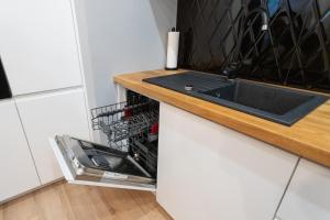 Kuchyňa alebo kuchynka v ubytovaní Apartament 56