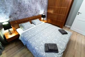 Posteľ alebo postele v izbe v ubytovaní Apartament 56