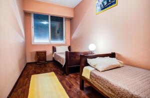 a bedroom with two beds and a window at 500 Meters from Grate Beach, App 9 in Ulcinj