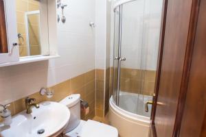 a bathroom with a toilet and a sink and a shower at 500 Meters from Grate Beach, App 9 in Ulcinj